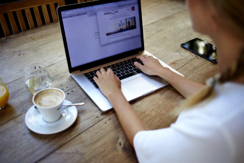 A Woman Using Macbook